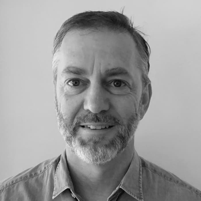 Headshot of PosMed founder, Simon Craig