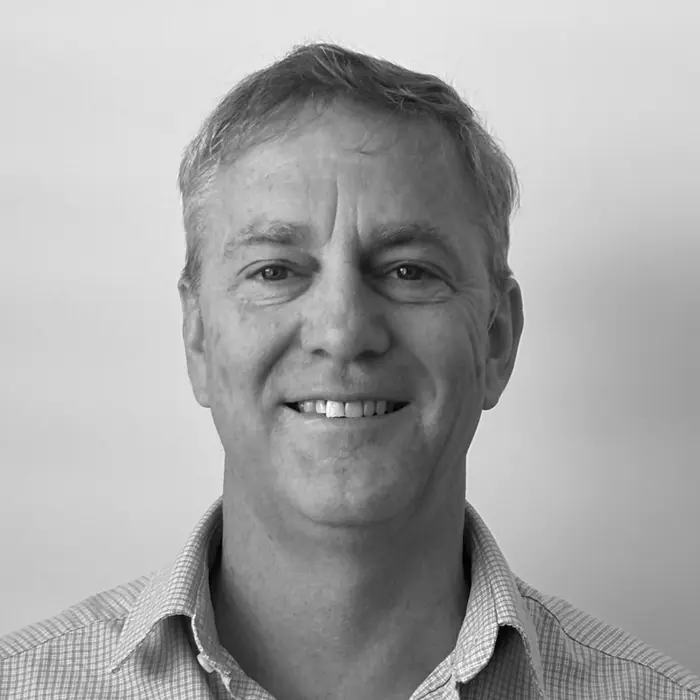 Headshot of PosMed founder, Simon Craig